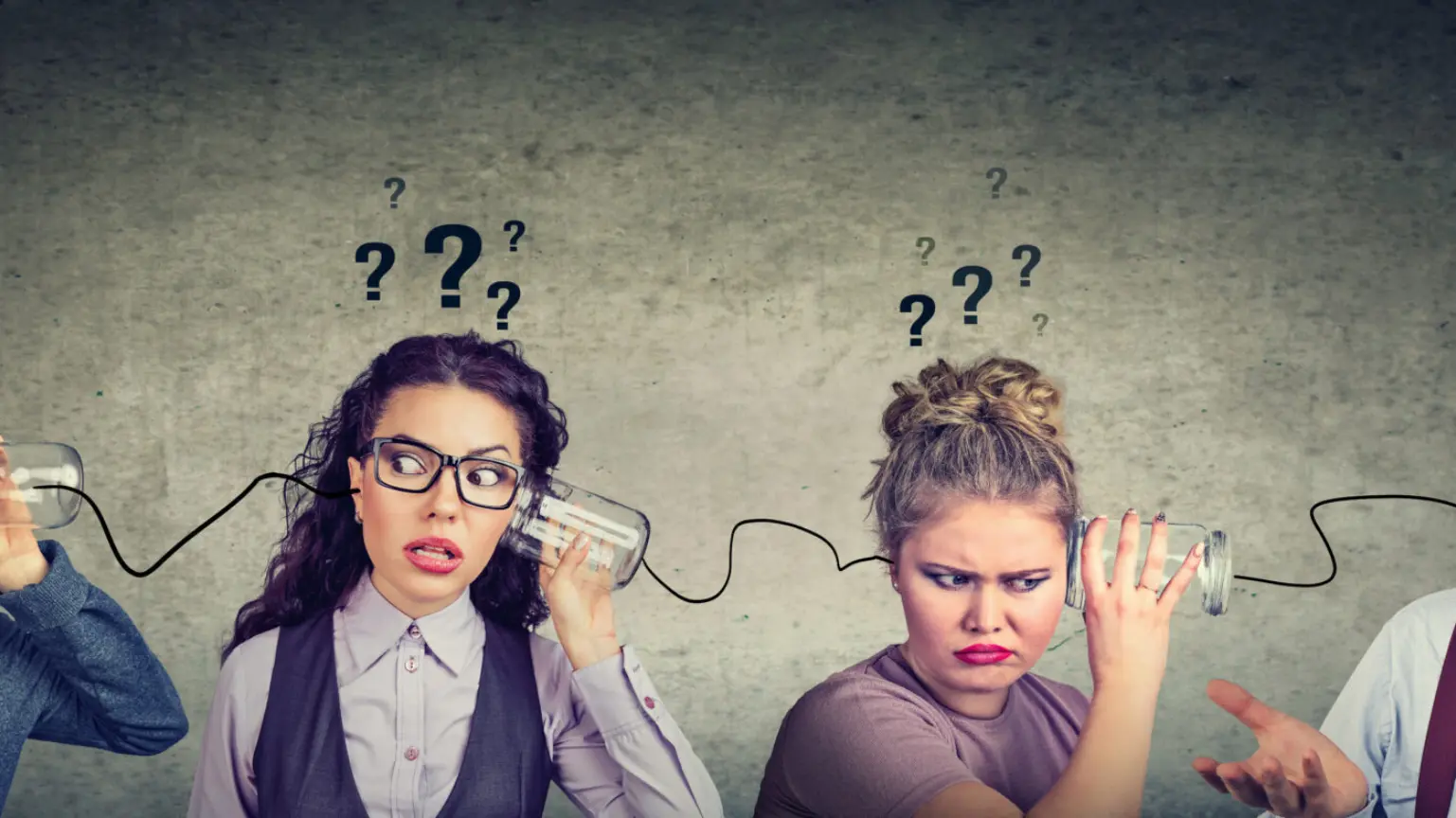 Two women using tin can phones with confused expressions and question marks above their heads.
